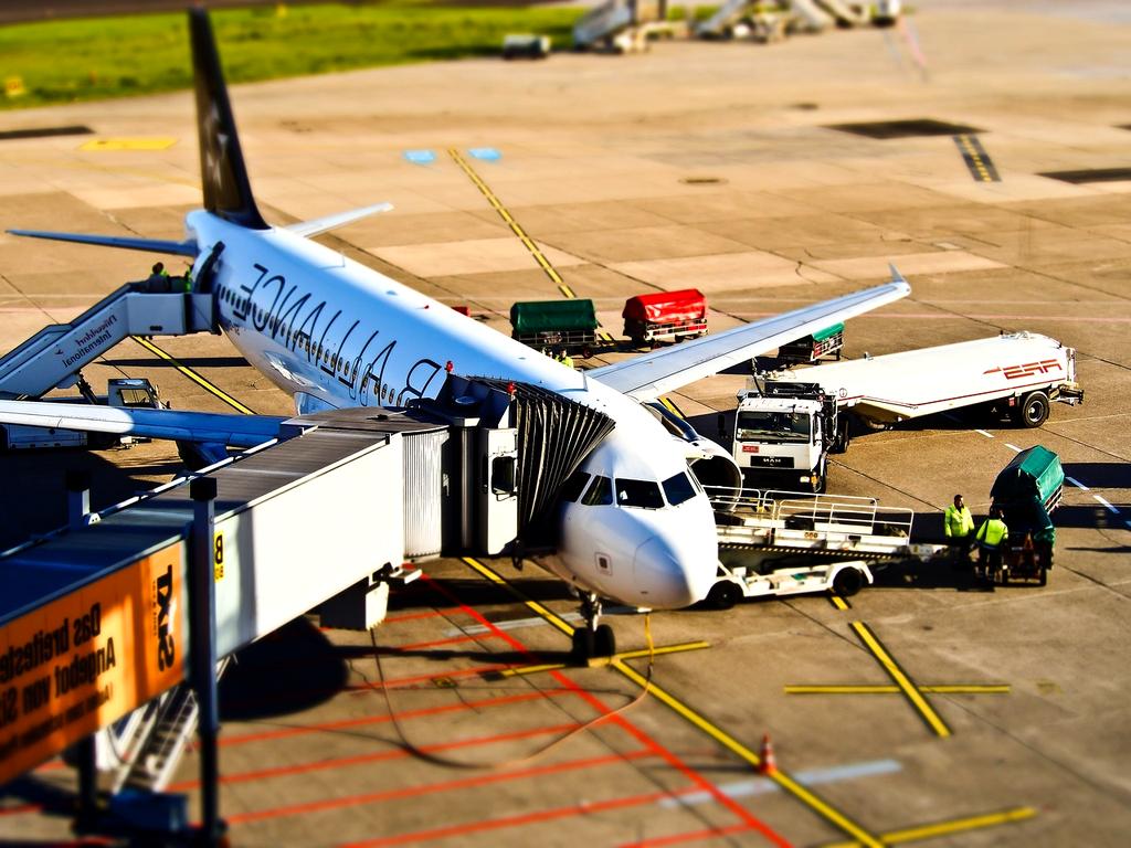 Photo of international travelers at an airport terminal
