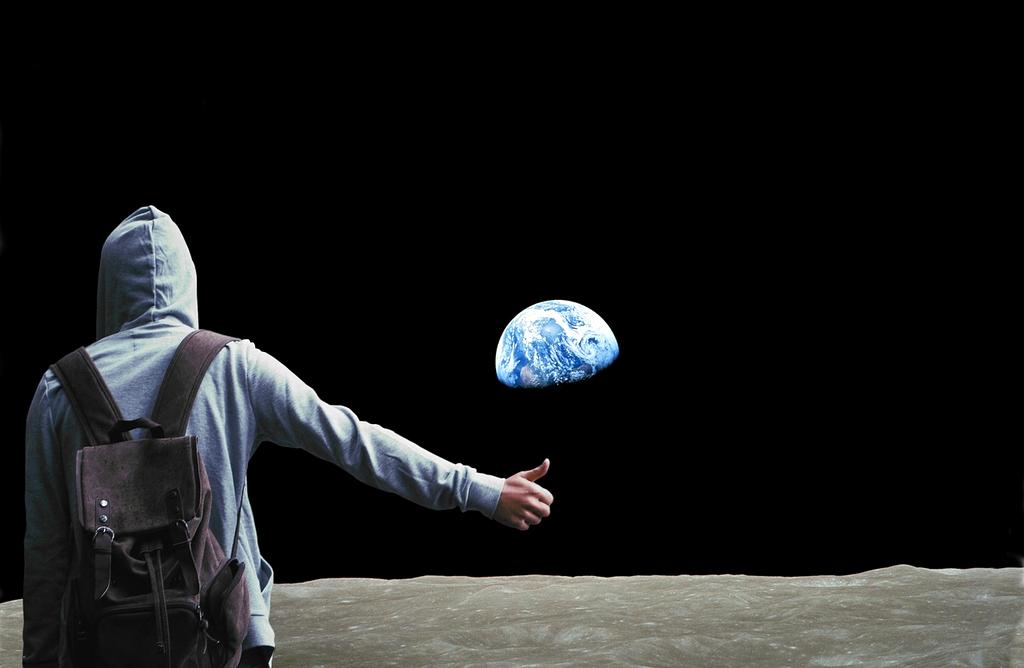 Traveler reading a travel blog on a tablet at sunset